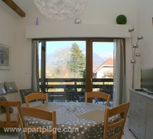 Main living space, view onto adjoining large balcony, apartplage, Saint-Jorioz